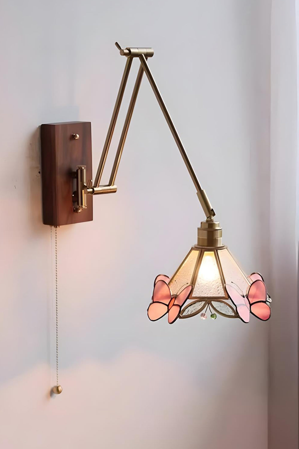 Cynthia Butterfly Articulated Wall Lamp | Stained Glass, Metal, Wood | Profile side view of the unlit articulated lamp mounted on a plain white wall, showing its extended arm reach | vexa lamps