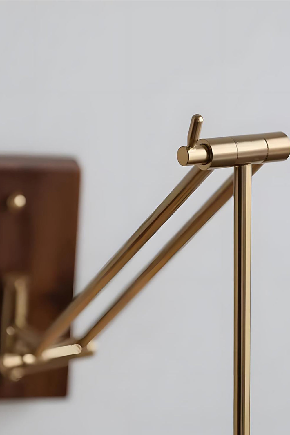 Cynthia Butterfly Articulated Wall Lamp | Stained Glass, Metal, Wood | Close-up focus on the multi-jointed mechanical brass articulated swing arm mechanism | Detail shot | vexa lamps