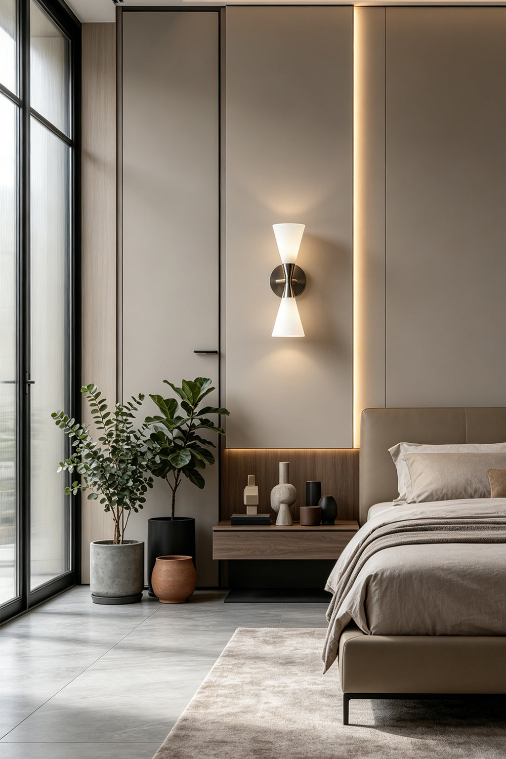 Diabolo Symmetry Glass Wall Sconce illuminating a modern bedroom with stylish decor and geometric design elements.