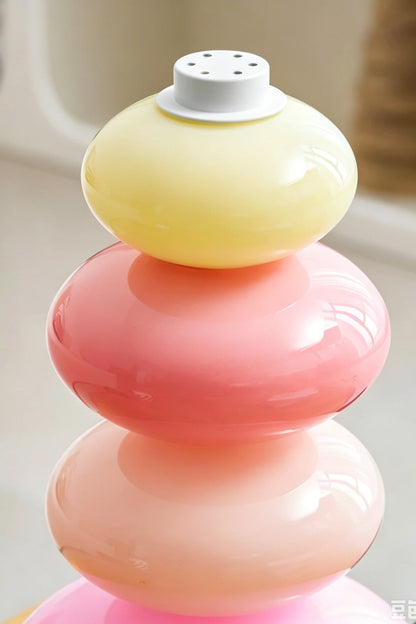 Dolce Stacked Pastel Glass Table Lamp | Glass, Metal | Detailed close-up showing the translucent pastel yellow and pink rounded glass segments | Detail shot | vexa lamps