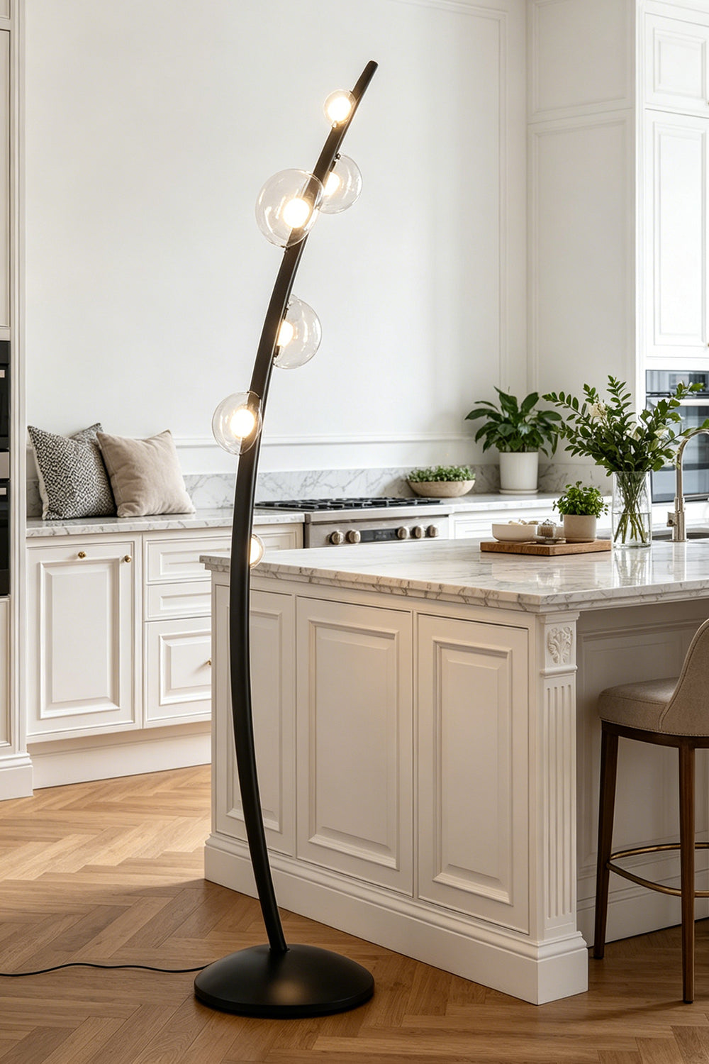 Drosia Dewdrop Floor Lamp | Glass, Metal | Positioned as an artistic decorative fixture in a modern bright kitchen next to a pristine white marble island counter | vexa lamps