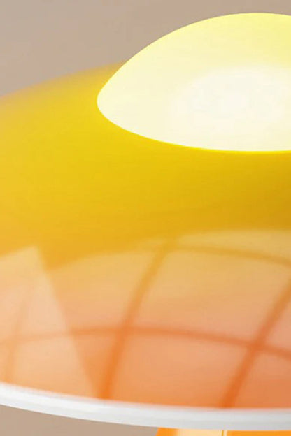 Duskora Retro Mushroom Table Lamp | Ceramic, Glass | Macro close-up profile of the glowing orange glossy dome shade under warm illumination, displaying smooth light diffusion | Detail shot | vexa lamps