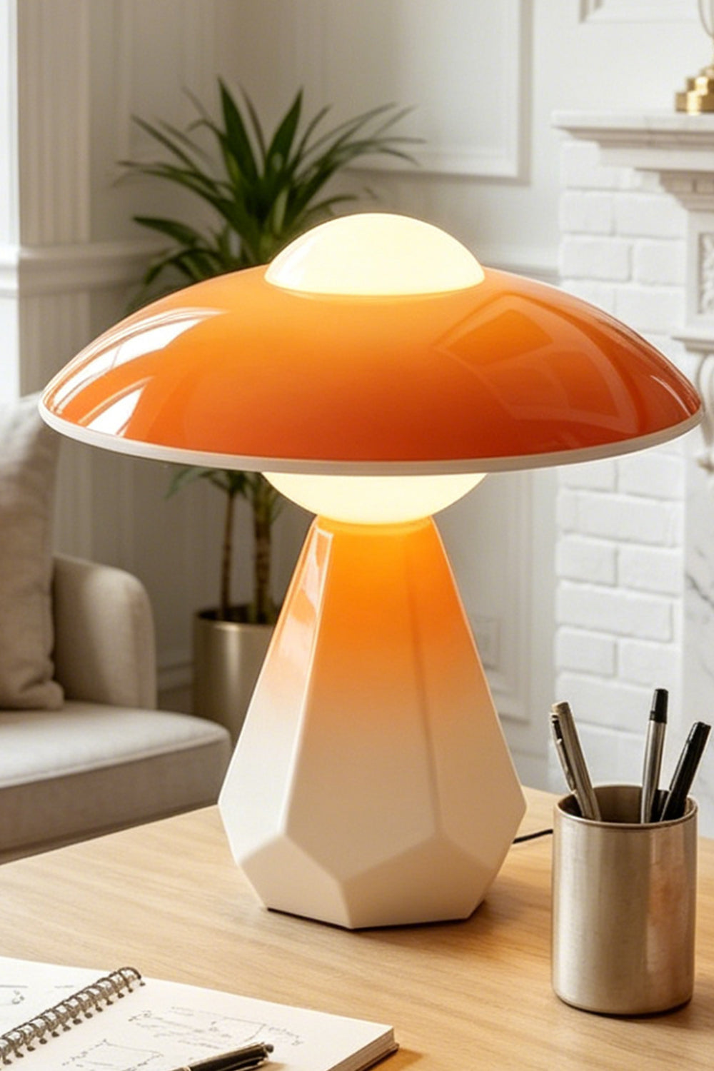 Duskora Retro Mushroom Table Lamp | Ceramic, Glass | Close-up focus showcasing the unique architectural faceted geometric base and bright orange mushroom cap on a desk | Detail shot | vexa lamps