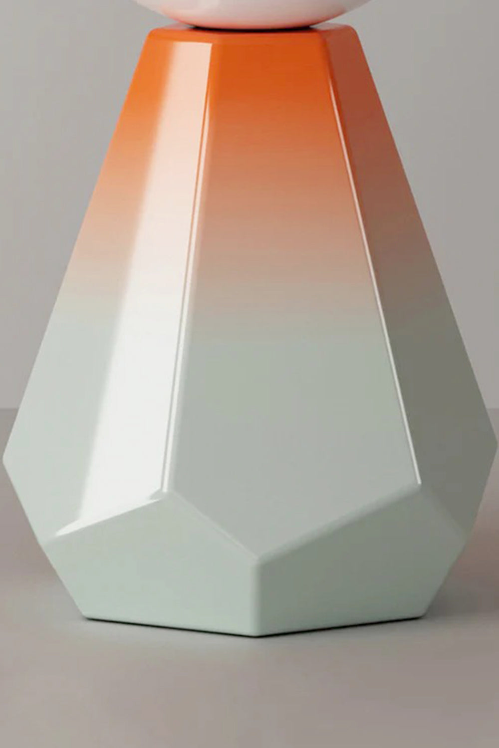 Duskora Retro Mushroom Table Lamp | Ceramic, Glass | Macro structural view focusing on the multi-faceted geometric base displaying its smooth mint green to orange gradient | Detail shot | vexa lamps