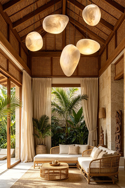 Elegant living room featuring the Elodie Teardrop Alabaster Pendant Light above a cozy seating area.