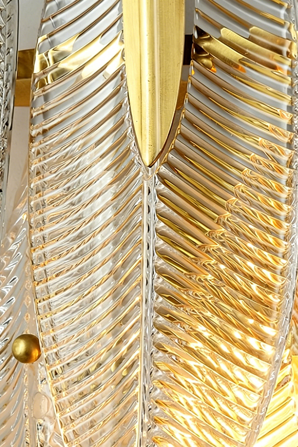 Elowen Cascading Glass Wall Lamp | Glass, Metal | Detailed close-up showing overlapping textured glass panels secured tightly on a gold frame with polished gold cylindrical nuts | Detail shot | vexa lamps