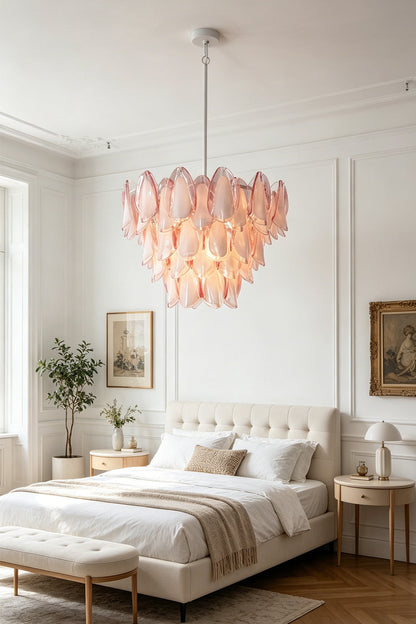 Elysian Bloom Rose Glass Chandelier hanging in a stylish master bedroom with modern decor.