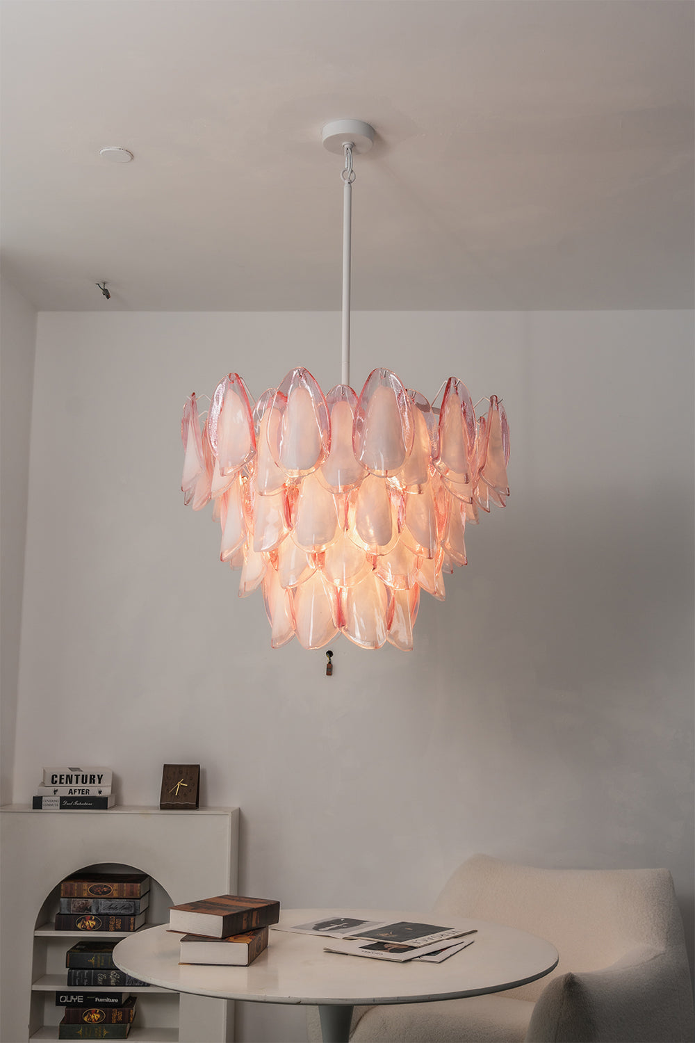 Elysian Bloom Rose Glass Chandelier | Metal, Glass | Positioned over a small round table and armchair in a minimalist room corner | vexa lamps
