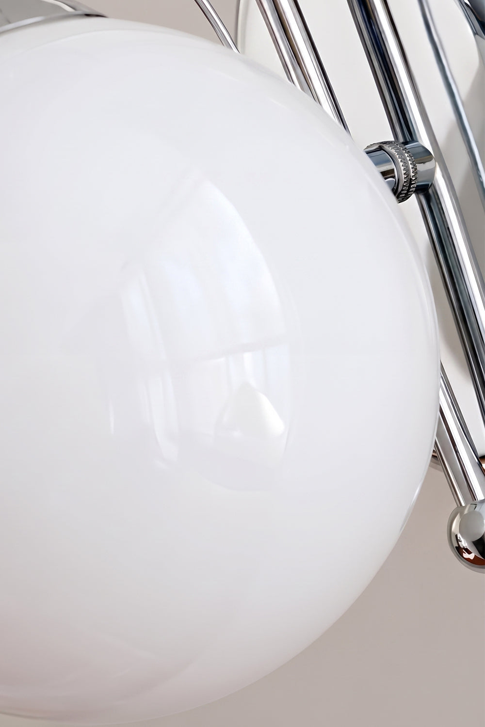 White frosted glass globe detail | Glass, Metal | Close-up showing chrome arm and base | vexa lamps
