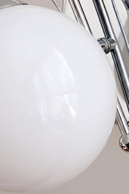 White frosted glass globe detail | Glass, Metal | Close-up showing chrome arm and base | vexa lamps