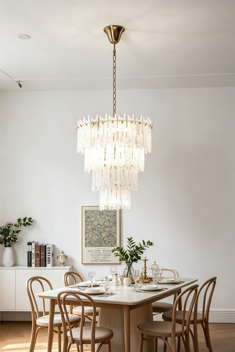 Ethereal Icicle Waterfall Chandelier | Glass, Metal | Illuminating a contemporary dining room setup above a wooden dining table and matching chairs | vexa lamps