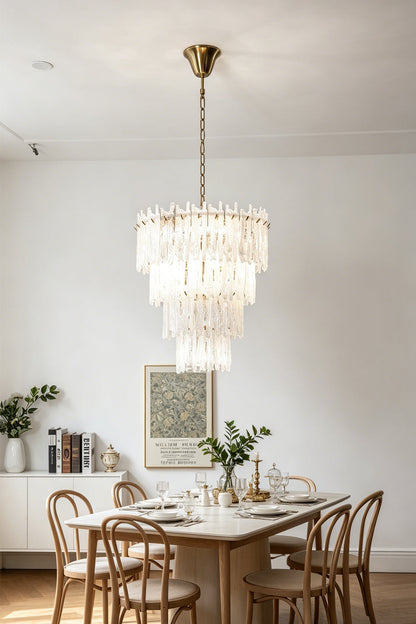 Ethereal Icicle Waterfall Chandelier | Glass, Metal | Illuminating a contemporary dining room setup above a wooden dining table and matching chairs | vexa lamps