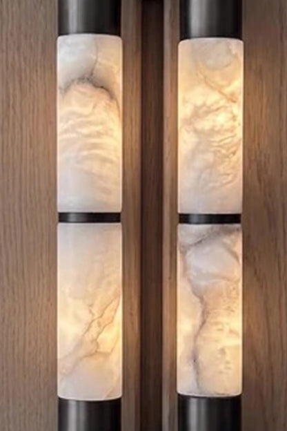 Evadne Alabaster Link Wall Sconce | Alabaster, Metal | Detailed close-up shot highlighting the intense cloudy translucent textures and unique mineral veining of the twin illuminated alabaster rods | Detail shot | vexa lamps