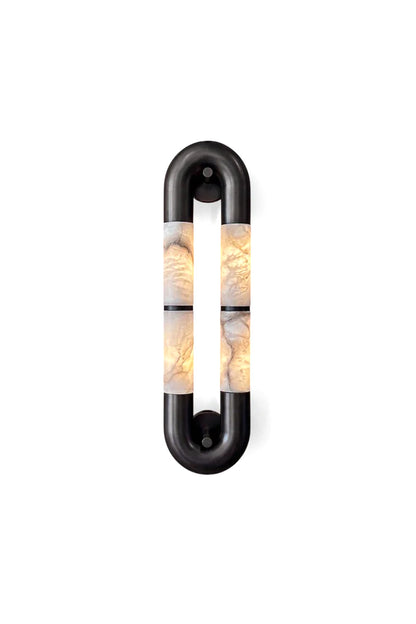 Evadne Alabaster Link Wall Sconce | Alabaster, Metal | Isolated lit view of a modern oval link wall sconce featuring a matte black metal frame enclosing two parallel vertical illuminated natural white alabaster stone columns | White background | vexa lamps