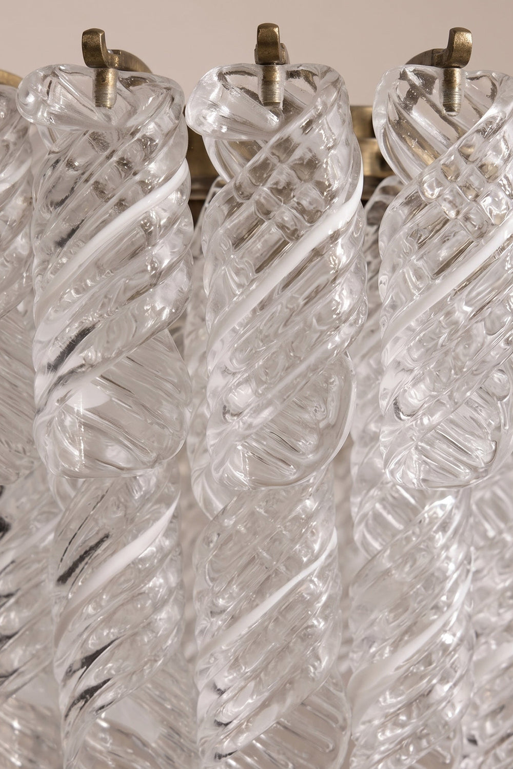 Evangeline Tiered Twisted Glass Chandelier | Unlit Glass Textures | Macro close-up shot focusing on the craftsmanship and spiral textures of the clear twisted glass reeds on metal hooks | Detail shot | vexa lamps