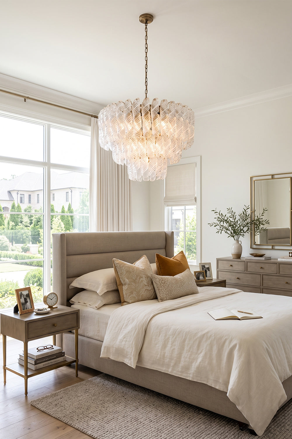 Evangeline Tiered Twisted Glass Chandelier | Luxury Bedroom Light | Positioned gracefully above a contemporary platform bed with neutral linens in a high-ceilinged elegant bedroom | vexa lamps