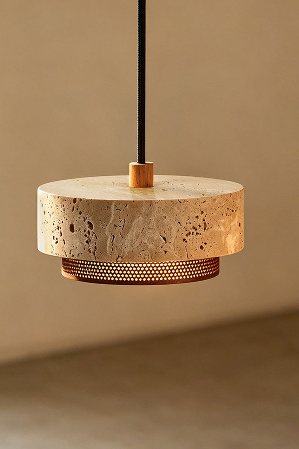 Evora Travertine Pendant Light showcasing raw travertine stone and perforated metal diffuser in modern design.