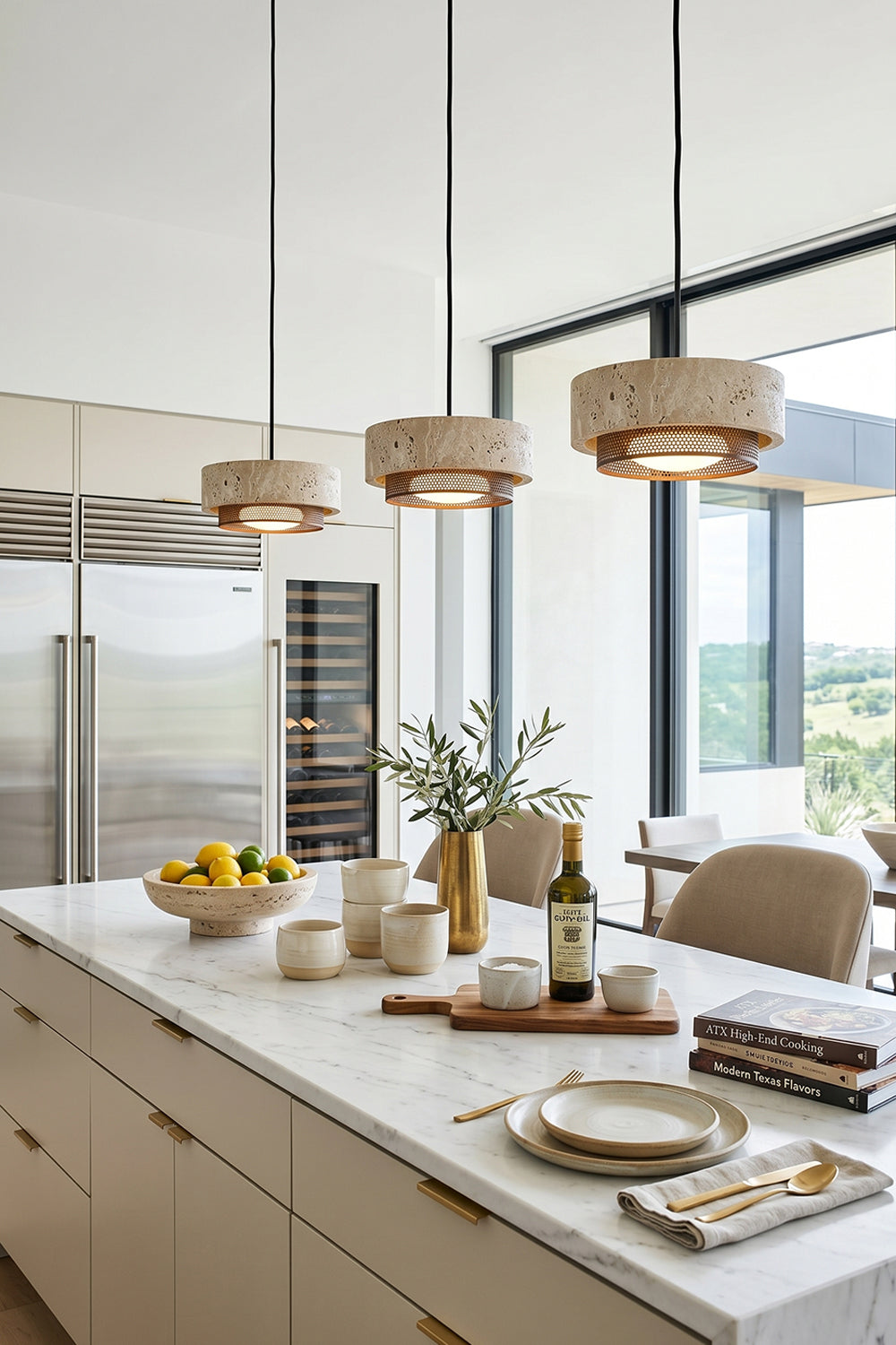 Evora Travertine Pendant Light above a modern kitchen island with minimalist decor and natural elements.