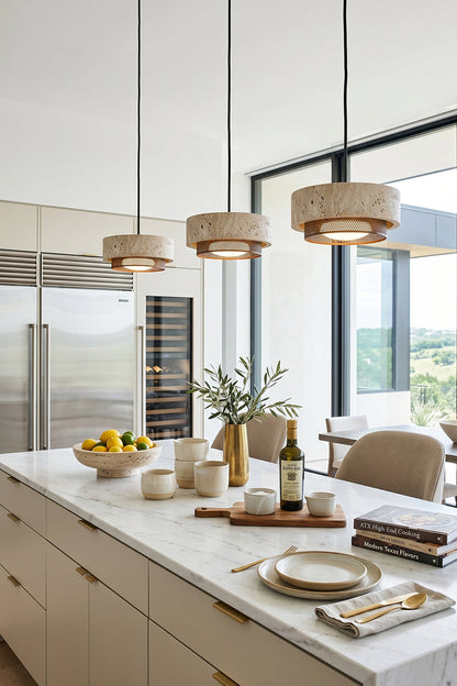 Evora Travertine Pendant Light above a modern kitchen island with minimalist decor and natural elements.
