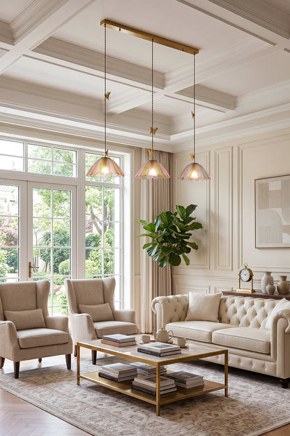 Faye Pastel Scalloped Glass Pendant Lamp | Glass, Metal | 3-light linear canopy variant installed over a wooden coffee table in a luxurious traditional living room | vexa lamps