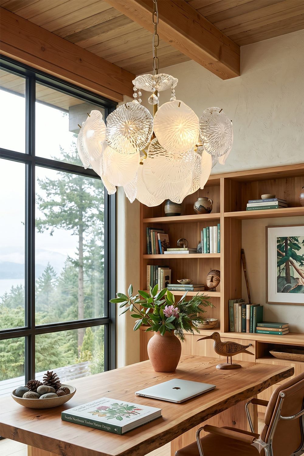 Fiore Radiance Glass Disc Chandelier hanging above a wooden desk in a bright, modern interior.