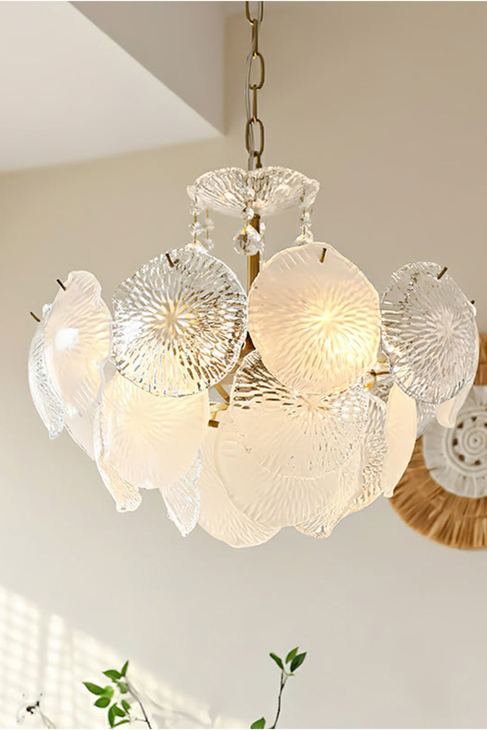 Fiore Radiance Glass Disc Chandelier with cascading glass discs and warm illumination in a modern space.