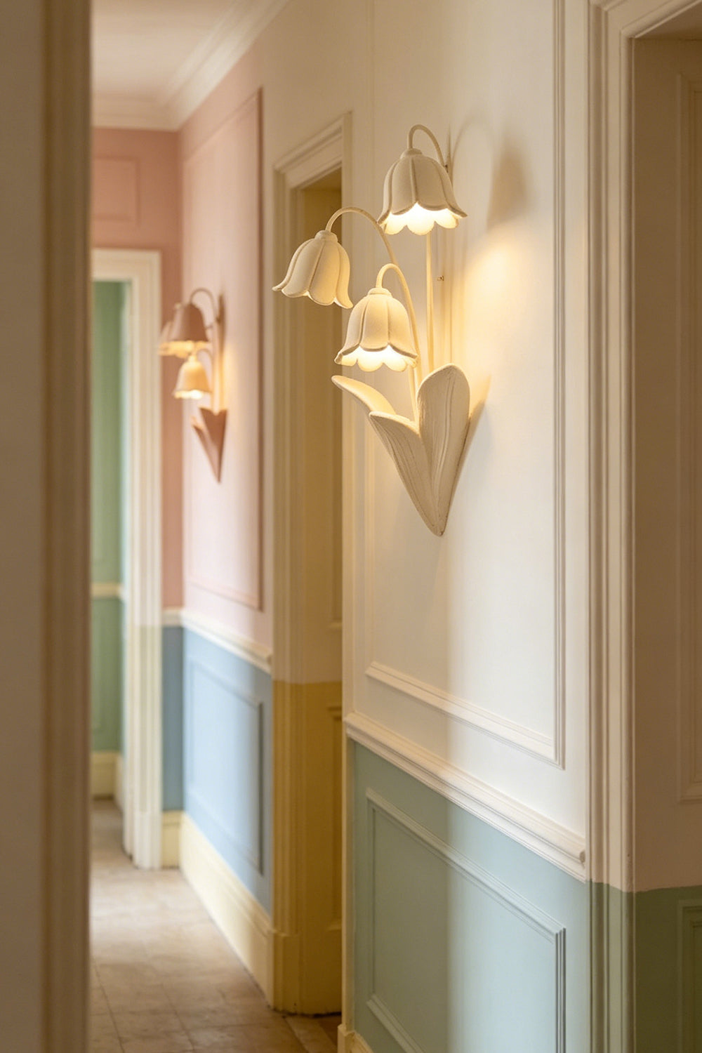 Lit Flora Muse wall lamp in a classic hallway with wainscoting | Metal, Resin |