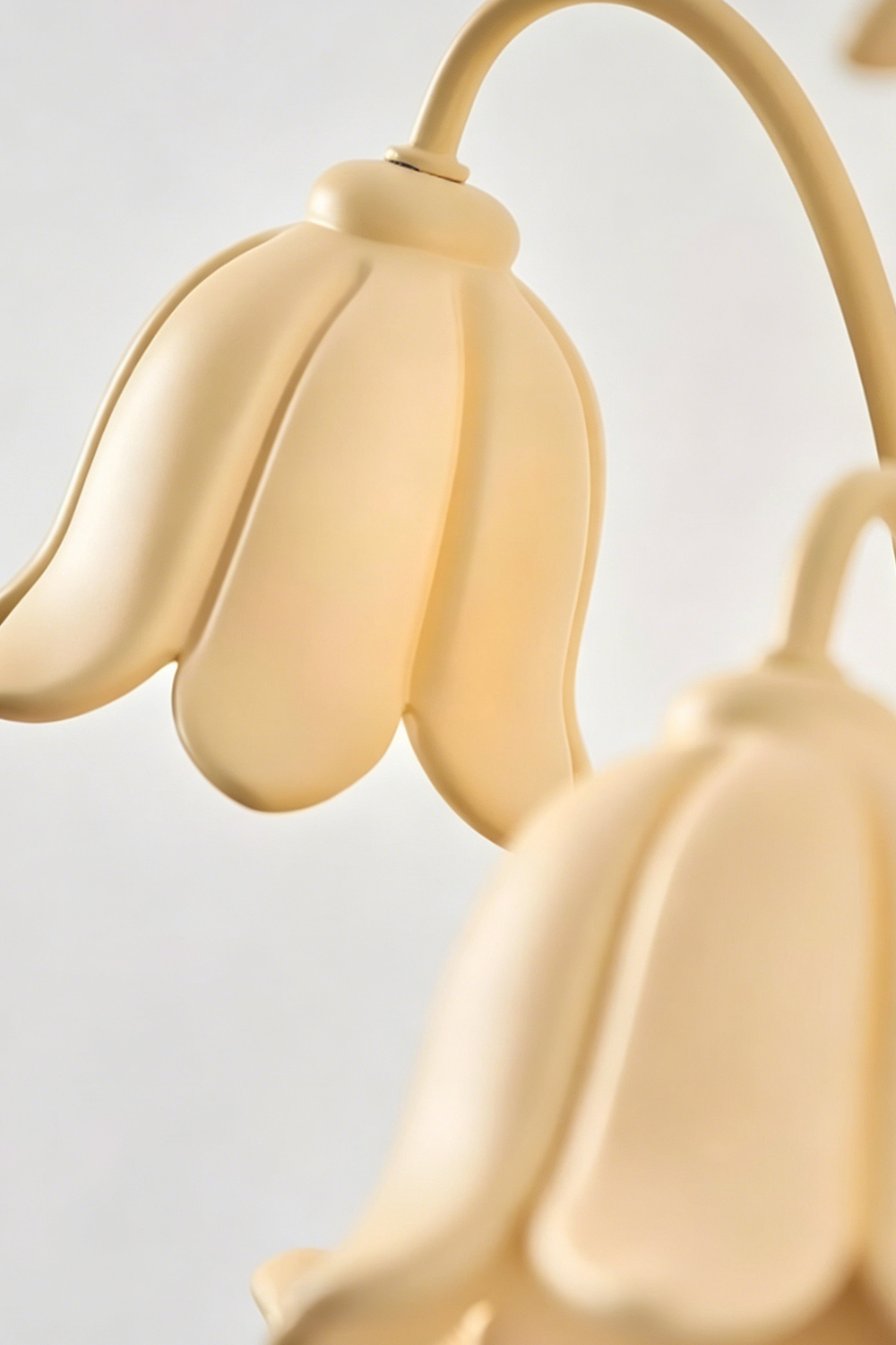 Detailed close-up of the resin bell-shaped flower shades | Resin |