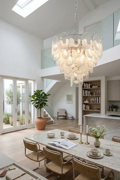 Large Frostelle Art Chandelier in a high-ceiling dining room | Metal, Glass | Interior scene over a long dining table | vexa lamps