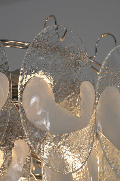 Close-up of lit glass leaves on the Frostelle chandelier | Glass | Detail shot showing light through textured glass | vexa lamps