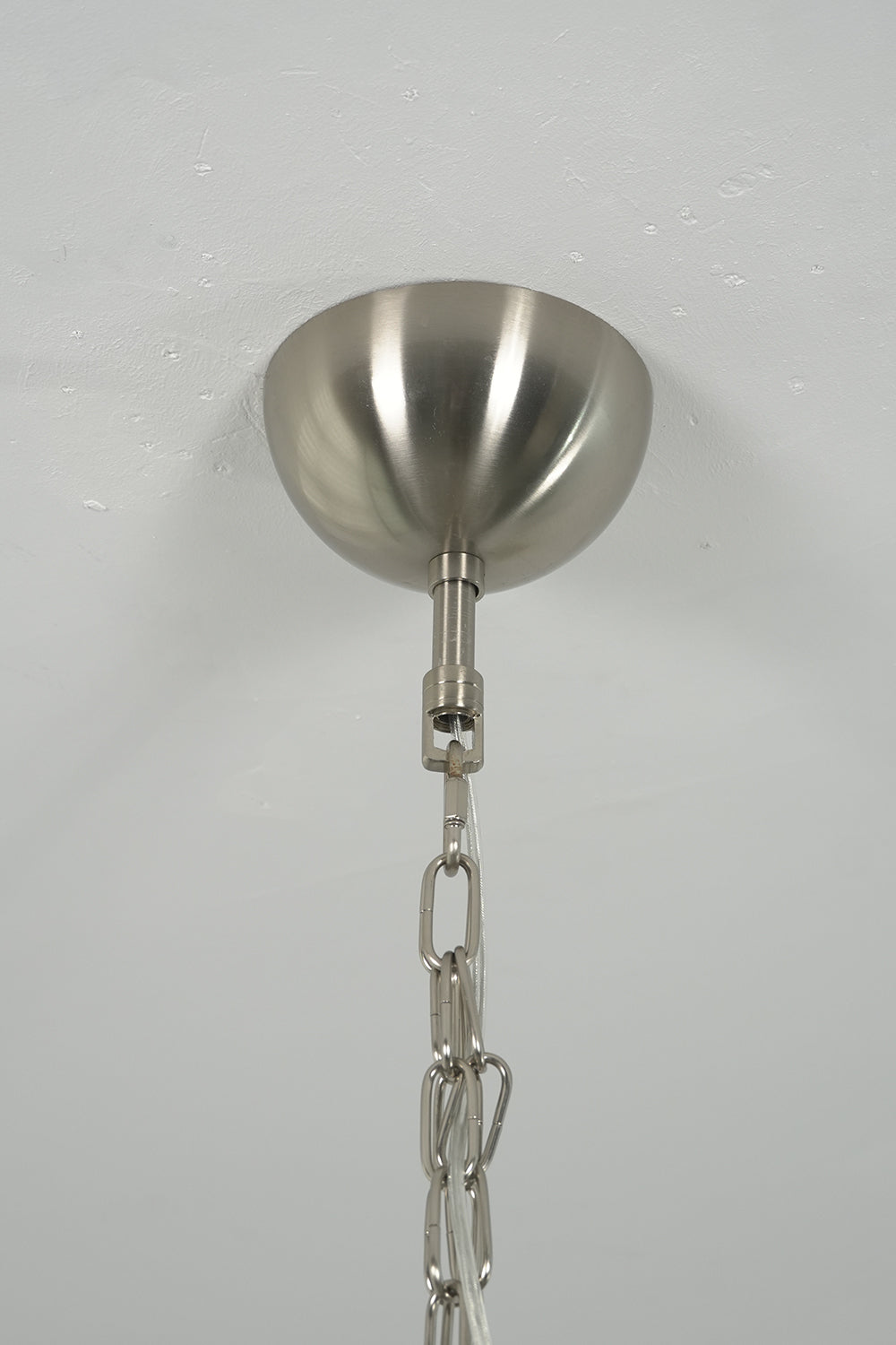 Metal ceiling canopy and chain for glass chandelier | Metal | Close-up of the silver-finish mounting hardware | vexa lamps