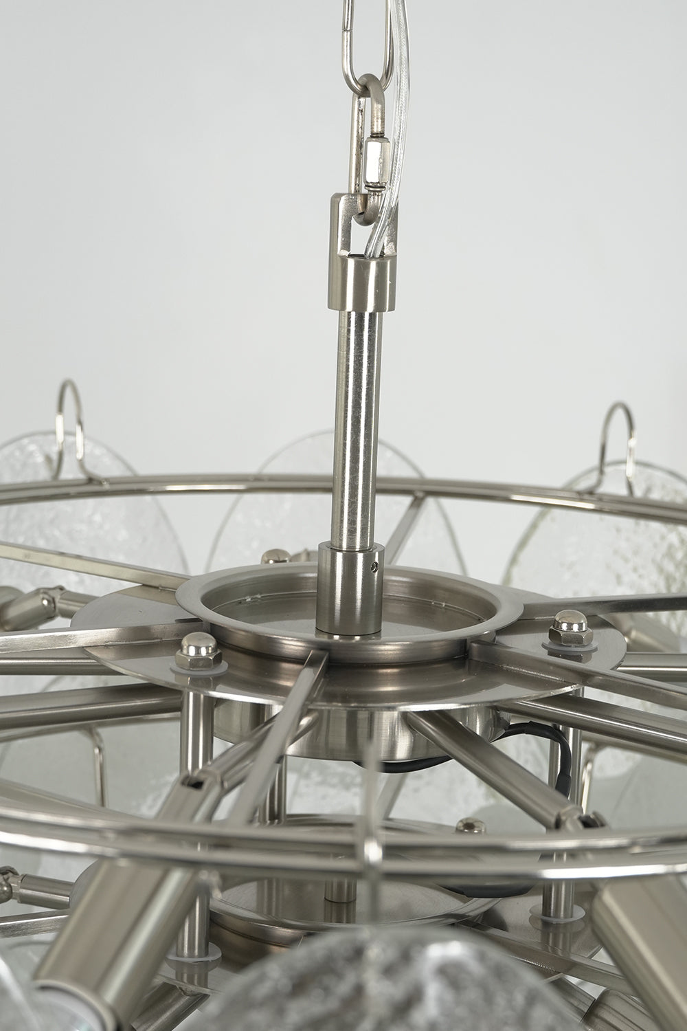 Internal metal frame and ring structure of Frostelle chandelier | Metal | Close-up showing the tiered frame and sockets | vexa lamps