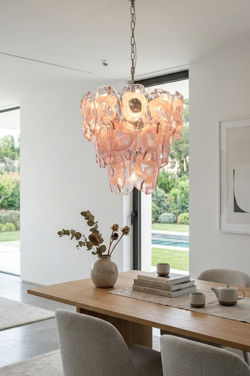 Frostelle pink glass chandelier | Metal, Glass | Over a wooden dining table in a bright room | vexa lamps