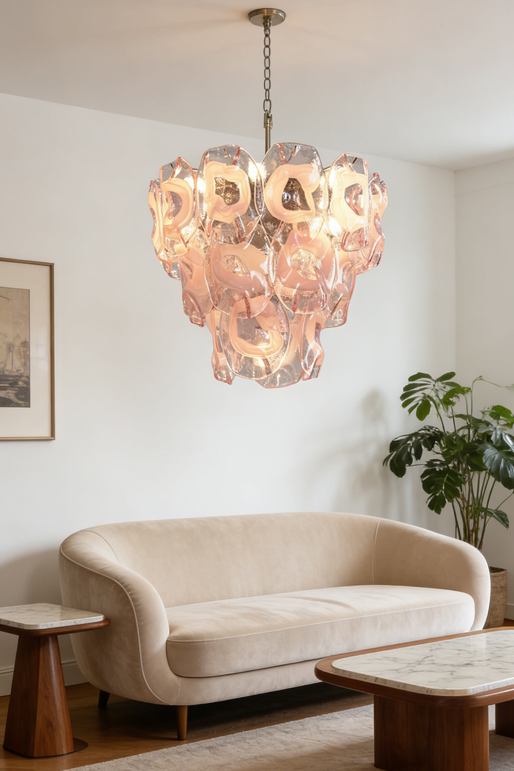 Tiered pink petal chandelier | Metal, Glass | Over a curved sofa in a contemporary living room | vexa lamps
