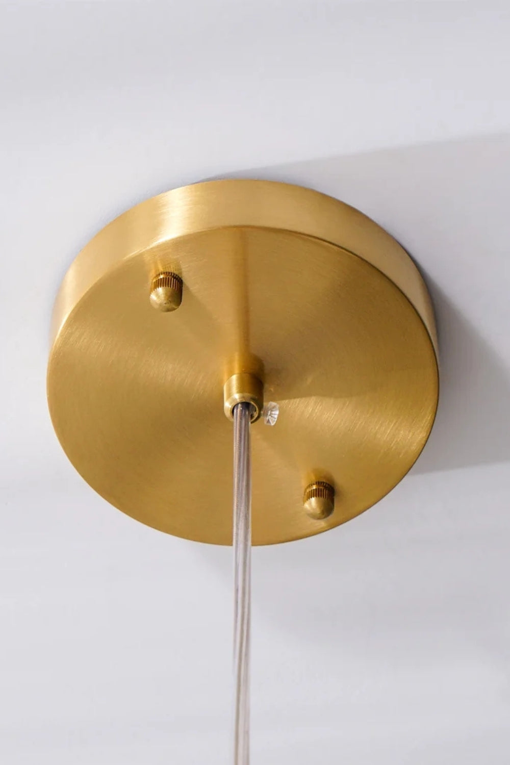 Elodie Teardrop Alabaster Pendant Light ceiling mount in sleek gold finish, showcasing modern design details.