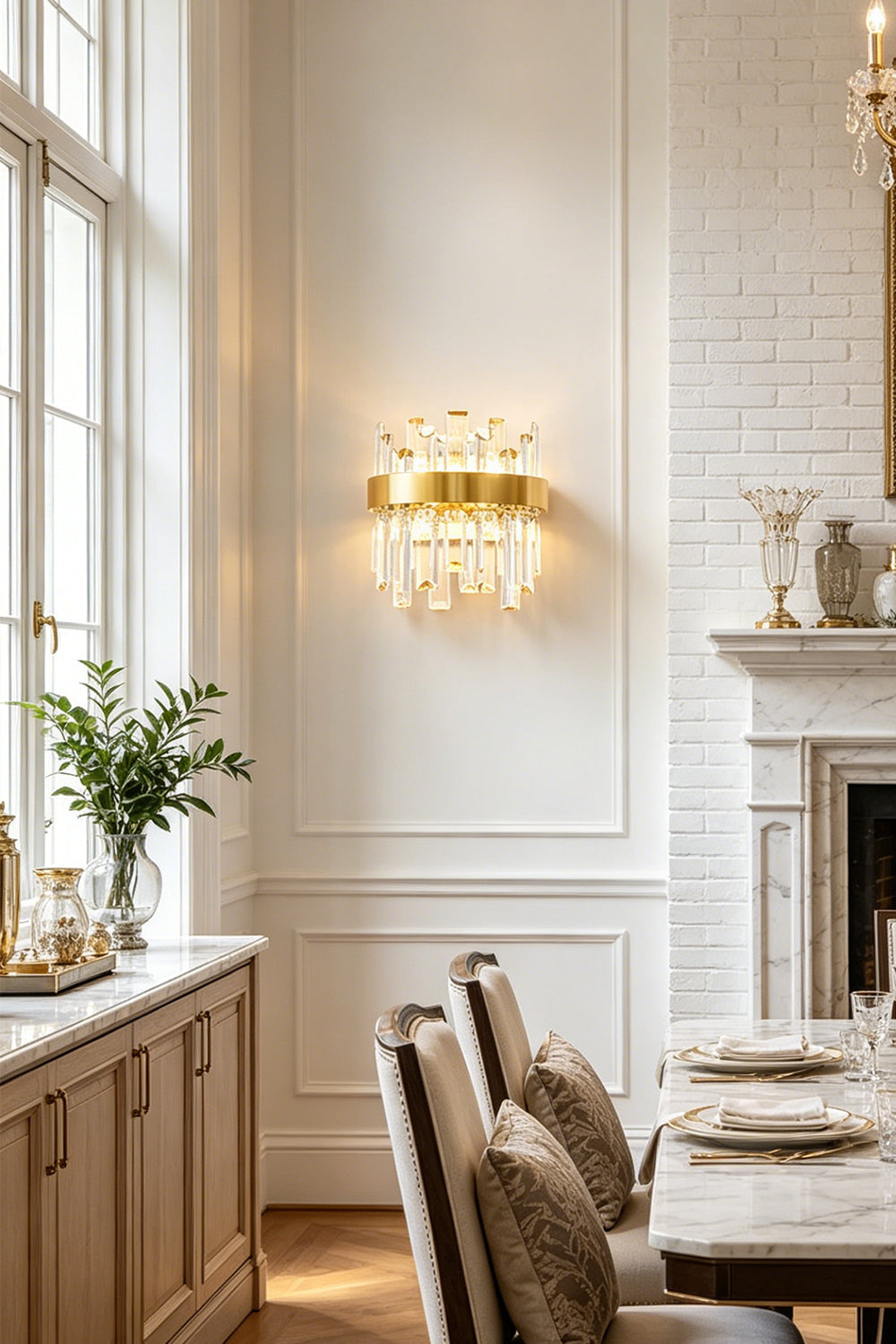 Glacia Tiered Crystal Statement Wall Lamp | Crystal, Metal | Providing sophisticated wall accent lighting in a classical dining space next to a long dining table and white paneled walls | vexa lamps