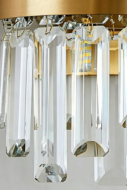 Glacia Tiered Crystal Statement Wall Lamp | Crystal, Metal | Close-up focus highlighting the hollow rounded bottom edge and sparkling facet reflections of the clear tiered crystal glass rods | Detail shot | vexa lamps