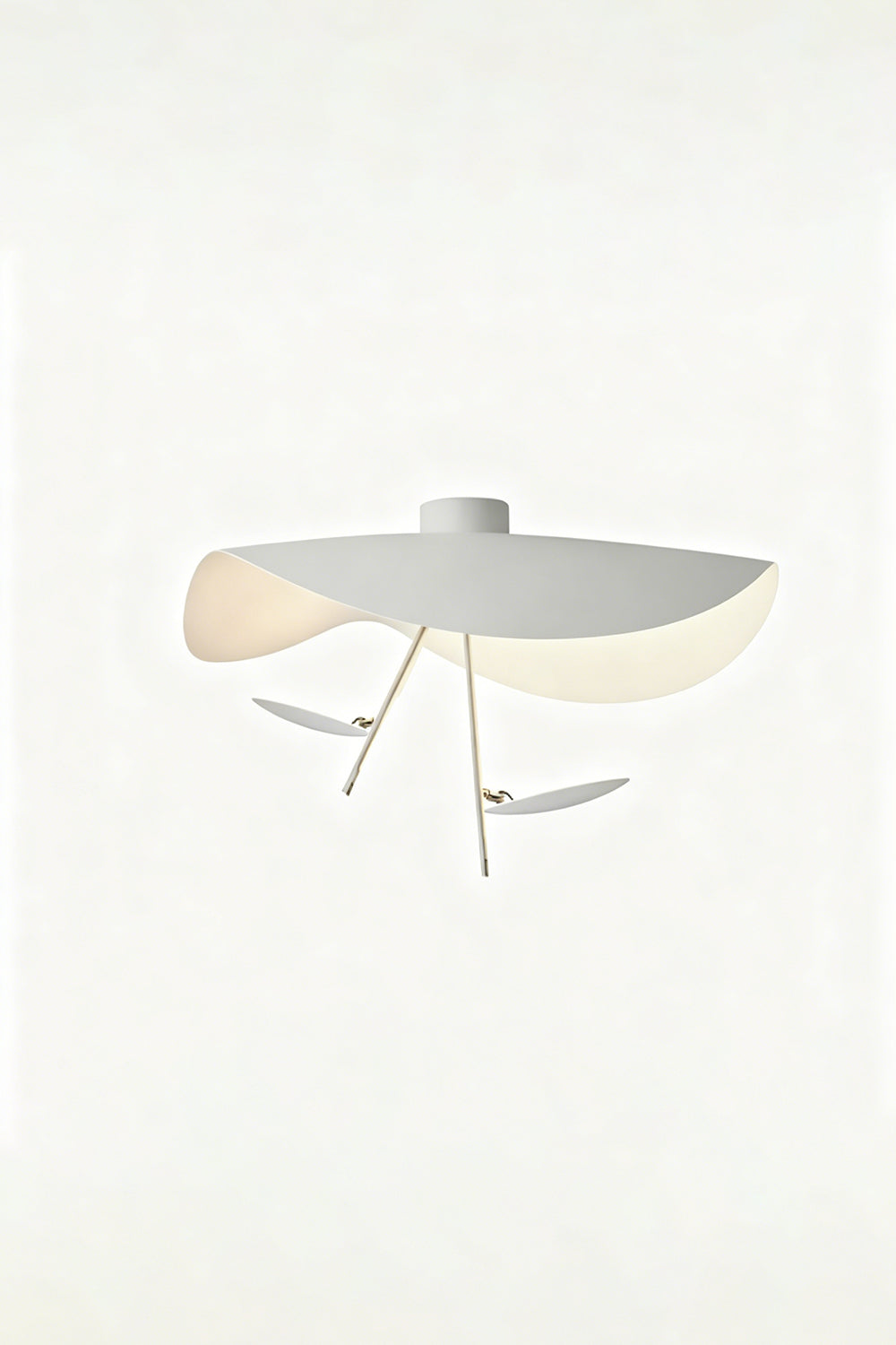Gold-Tone Sculptural Ceiling Light featuring fluid geometry and a wave-like design, illuminated with a warm glow.