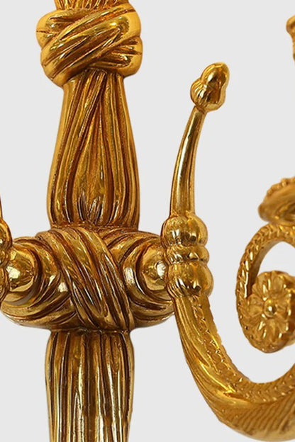 Honoria Rope and Tassel Brass Sconce | Brass and Metal | Close-up detail showing the intricate brass rope knot center structure | vexa lamps