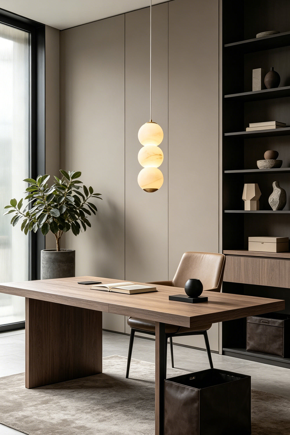Imperial Epoch Alabaster Pendant Lamp | Metal, Alabaster | Single pendant illuminating a wooden workspace with a large green plant | vexa lamps