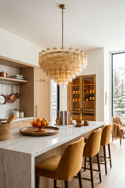 Isadora Tiered Amber Glass Chandelier illuminating a stylish kitchen with warm ambiance and elegant decor.