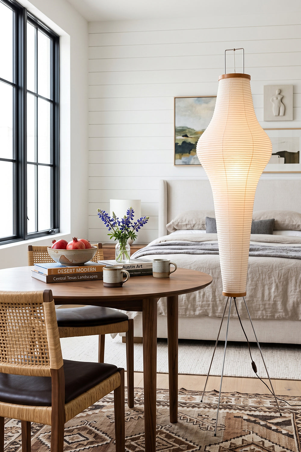 Isolde Ribbed Paper Column Floor Lamp in a stylish living room setting with a table and decorative elements.