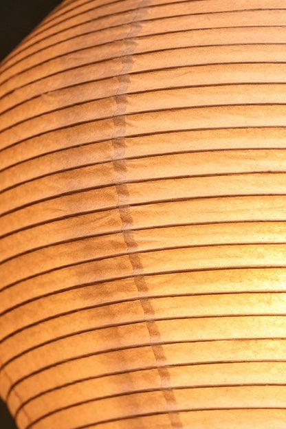 Close-up of the Isolde Ribbed Paper Column Floor Lamp showcasing its ribbed mulberry paper texture.