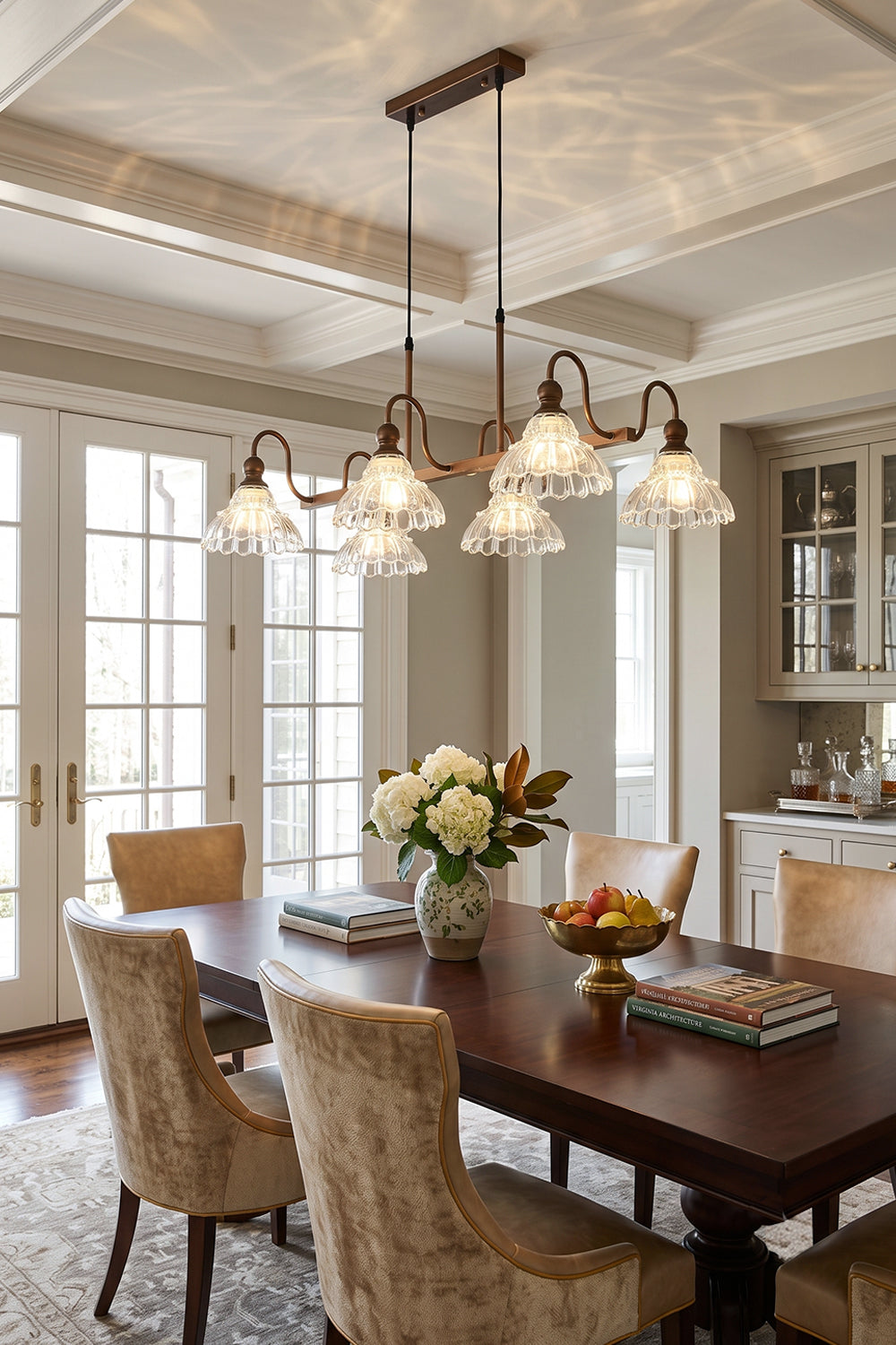 Isolde Vintage Glass Long Chandelier | Formal Dining Area | Positioned elegantly above a long traditional dining table surrounded by high-back cane chairs in a bright room | vexa lamps