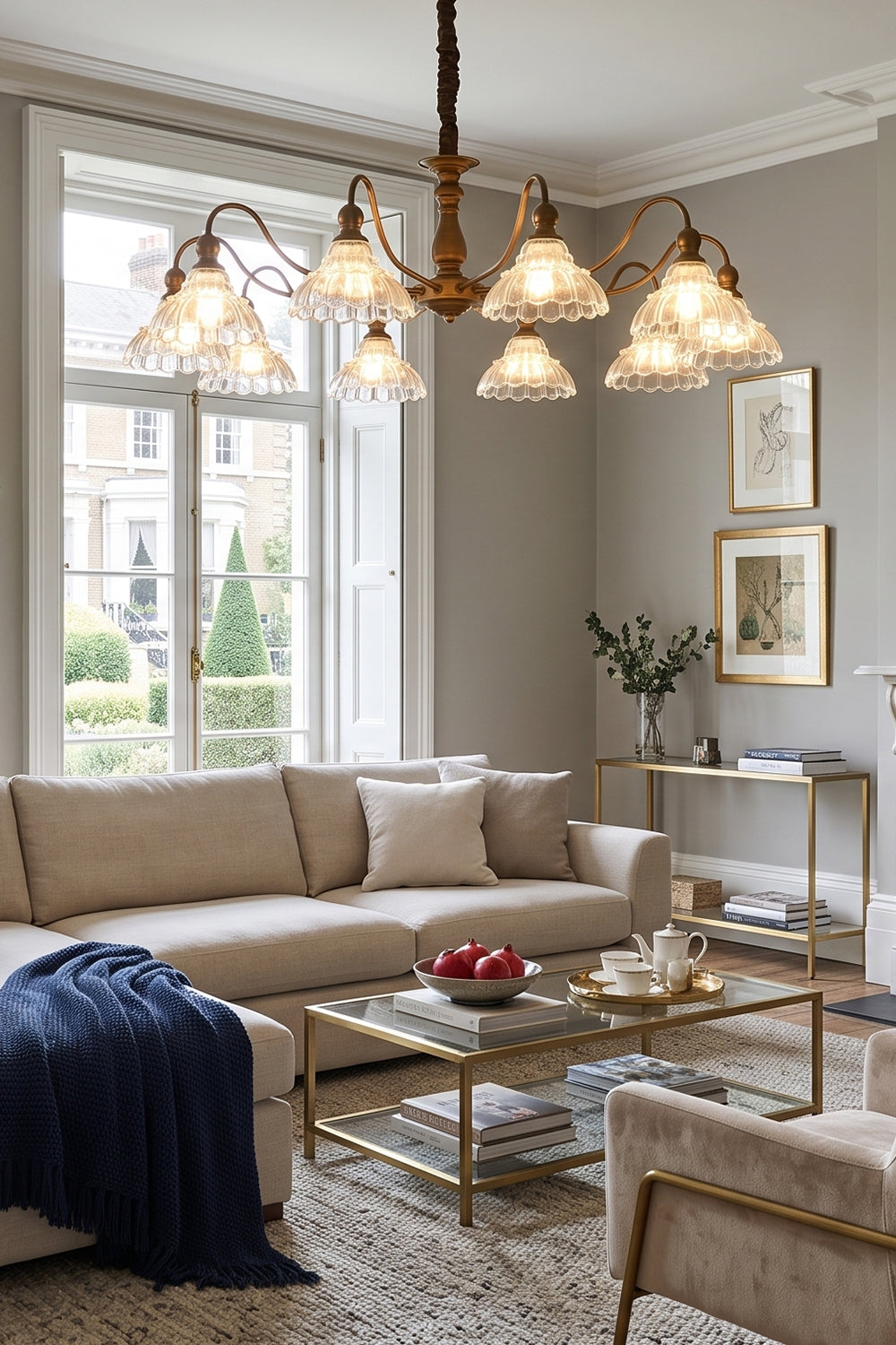 Isolde Vintage Scalloped Glass Chandelier | Cozy Sitting Area | Staged overhead in a classical living space casting a soft glow near a cream sofa with a navy blue blanket accent | vexa lamps