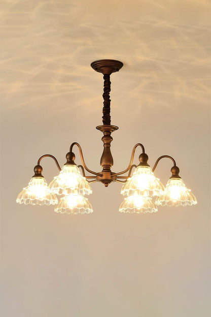 Isolde Vintage Scalloped Glass Chandelier | Dimmed Mood View | Low-light presentation of the fully lit scalloped glass fixture showcasing the warm glowing bulb filaments inside | vexa lamps