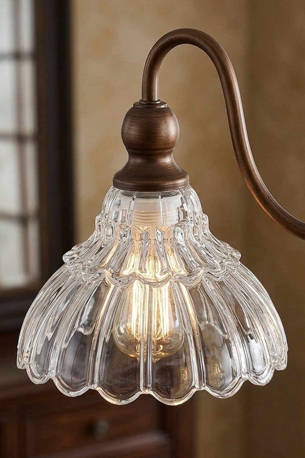 Isolde Vintage Scalloped Glass Chandelier | Scalloped Shade Close-up | Detailed macro shot of an individual clear ruffled glass flower-like shade attached to a dark bronze curved arm | Detail shot | vexa lamps