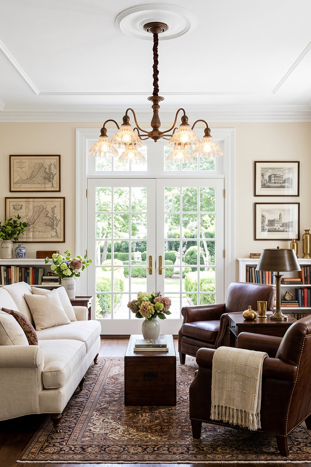Isolde Vintage Scalloped Glass Chandelier | Classical Living Room | Providing warm ambient lighting in an elegant traditional lounge room with a white sofa and plush leather armchairs | vexa lamps