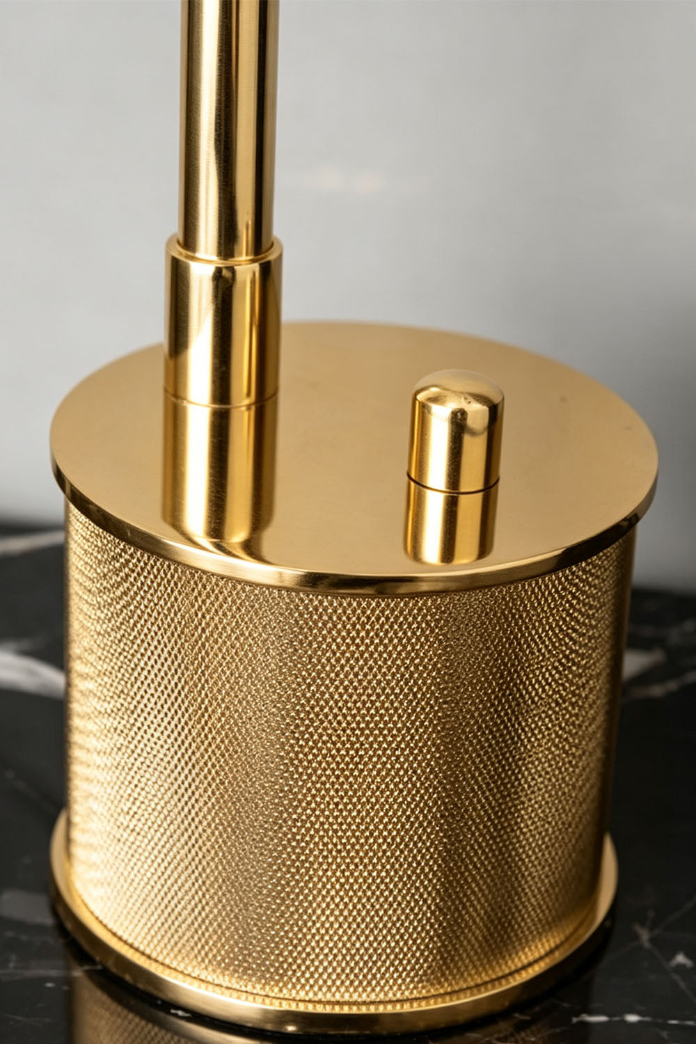 Ivor Knurled Brass Task Table Lamp | Knurled Brass and Metal | Macro close-up of the knurled textured brass cylindrical base and switch | vexa lamps
