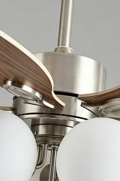 Keller Wooden Ceiling Fan Light | Wood, Glass, Metal | Detailed close-up shot focusing on the premium brushed silver metallic motor housing, dark wood blade connections, and white glass globes | Detail shot | vexa lamps